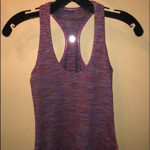 A fitted Multicolor striped Lululemon tank top.